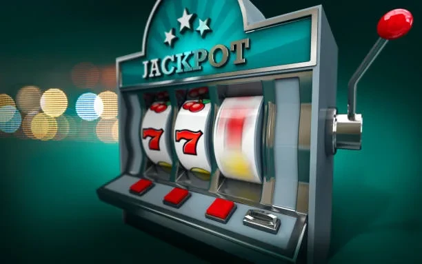 ‘JACKPOT’ লেখা একটি স্লট মেশিনের ছবি, পাশে লাল লিভার ও বোতাম দেখা যাচ্ছে।